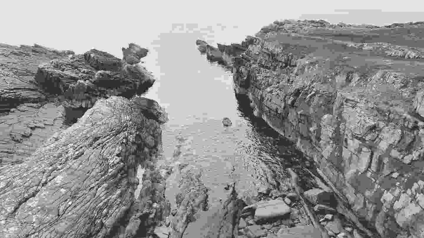 Small calm slipway into the sea right next to the broch