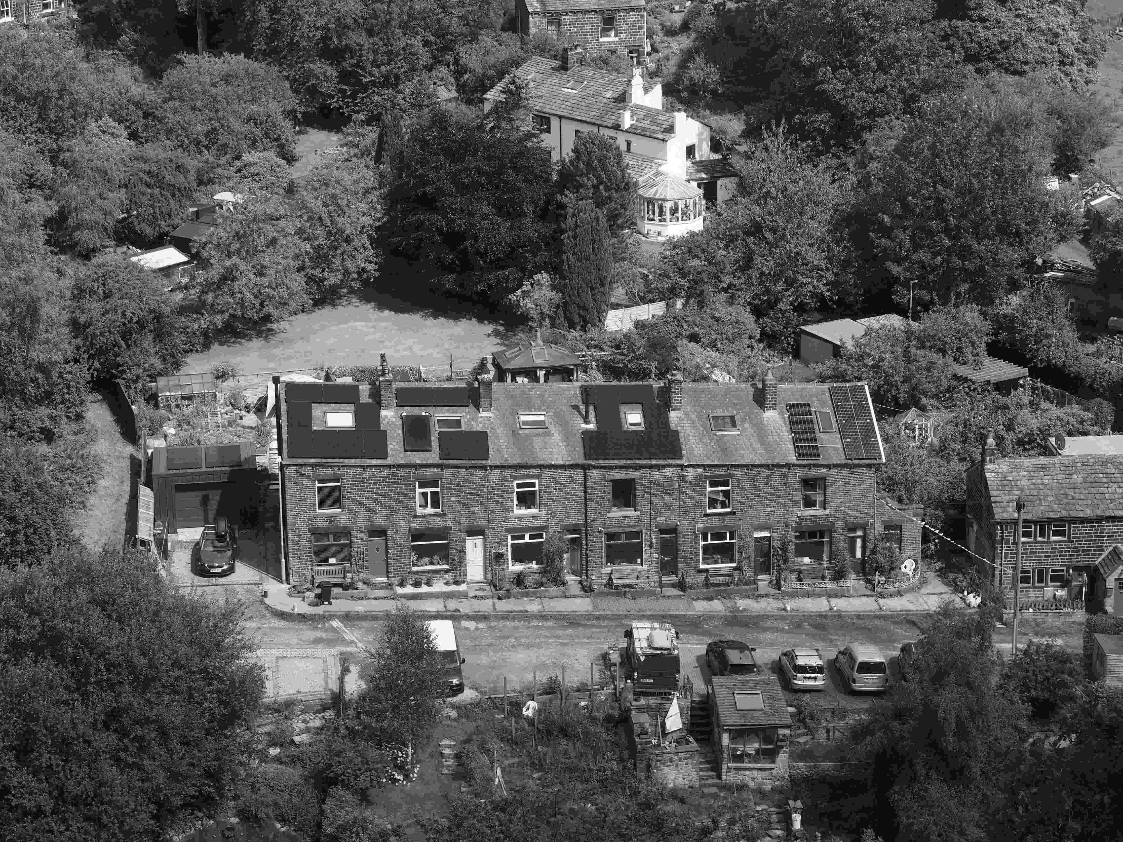 Home from the cliff opposite showing the newly installed solar panels