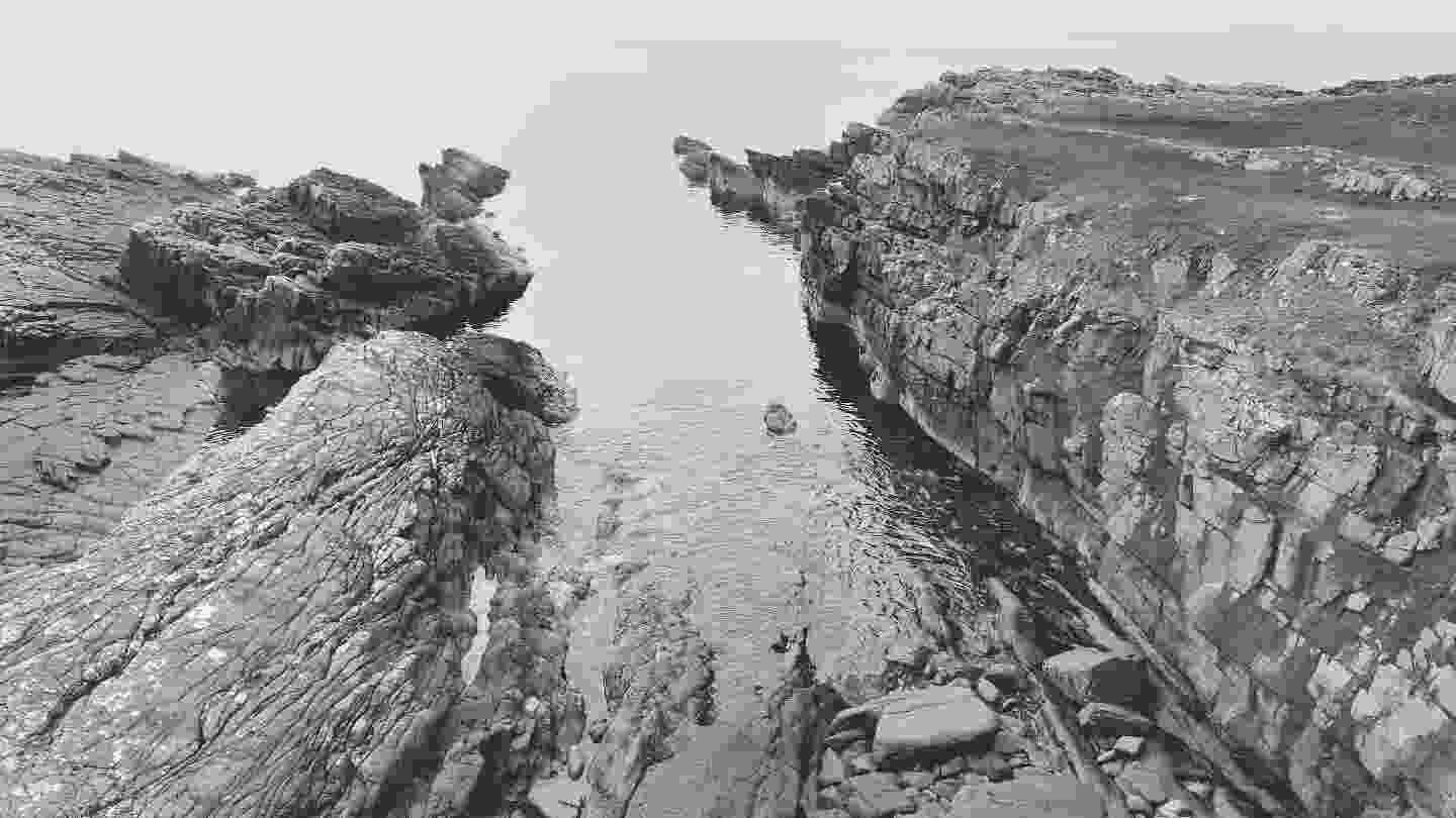 Small calm slipway into the sea right next to the broch